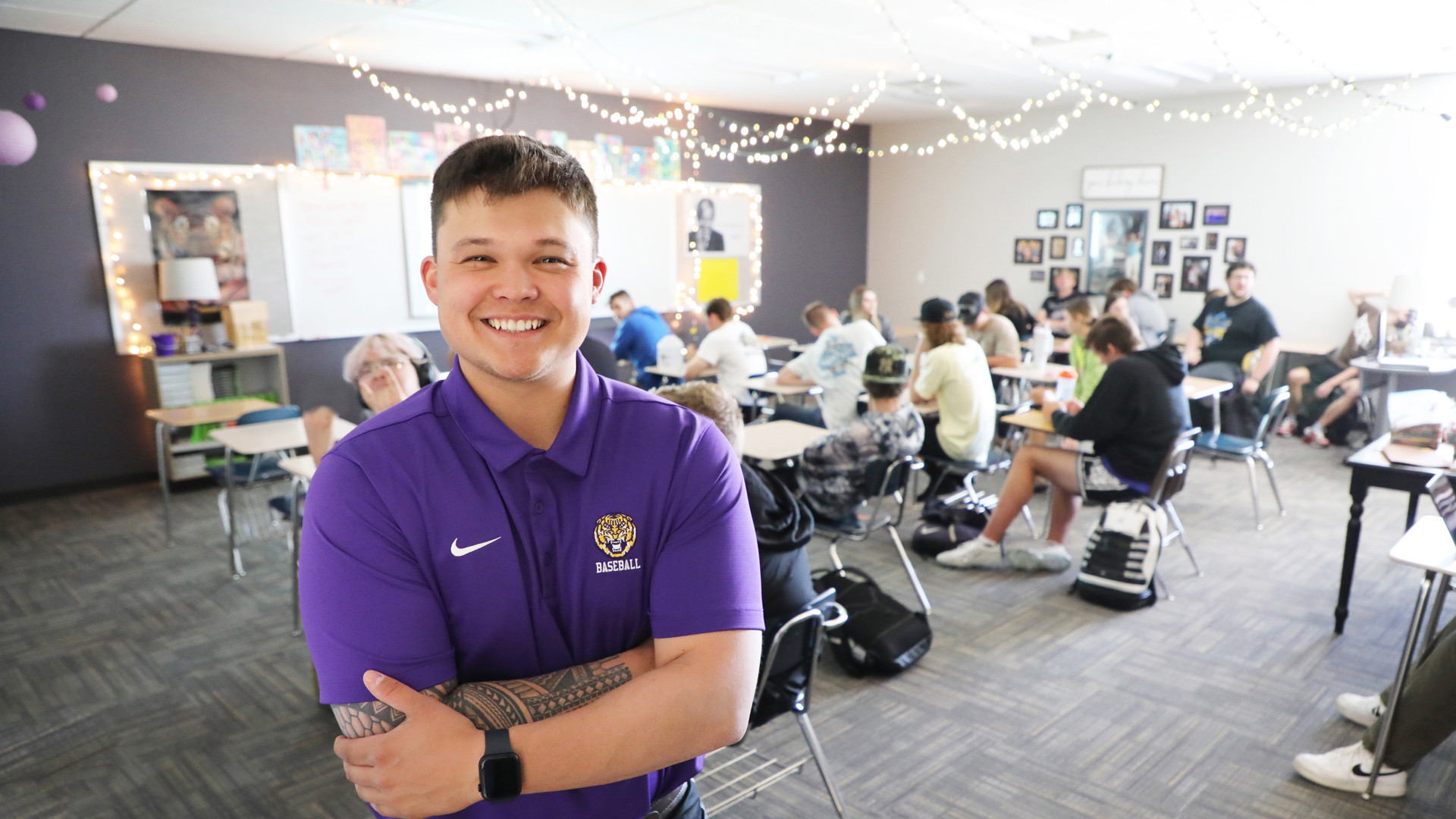 Student teaching posing for a photo at Lewiston High School classroom